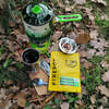 packaging next to stove on ground with leaves. Regular 110g size shown.