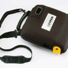 strap attached to soft shell carry case (sold separately)