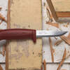 red knife on wood