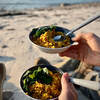 cooked dish on beach in 2 bowls