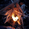 hand holding lit Behemoth Stormproof Sweetfire lighting kindling