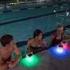 people in swimming pool with multiple Nova Colors on edge of pool